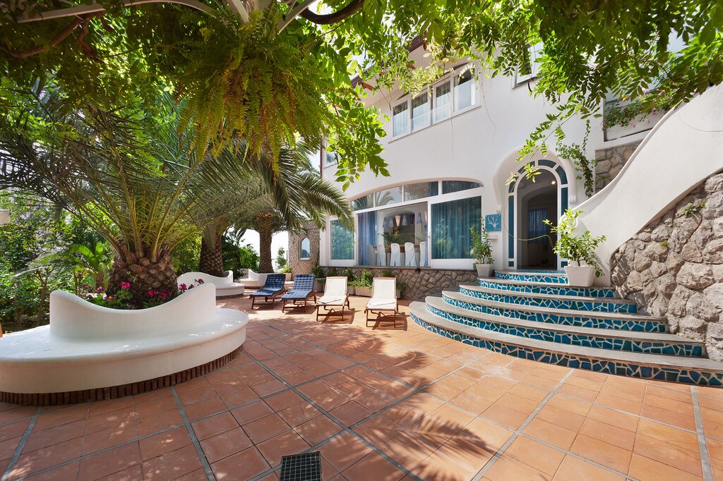 Steps to entrance and outdoor terrace and steps to outdoor kitchen on first floor level to right